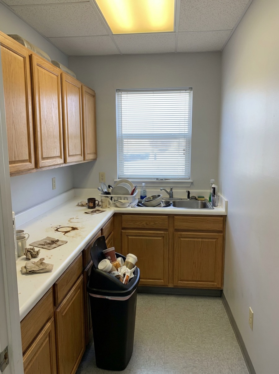 A cluttered break room before cleaning